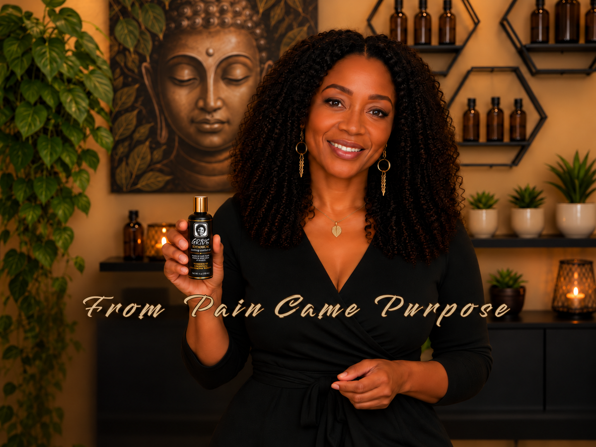 Smiling Black woman holding a bottle of GRIO’S Botanical Comfort Oil in a warm wellness setting with plants, Buddha artwork, and the words “From Pain Came Purpose.”