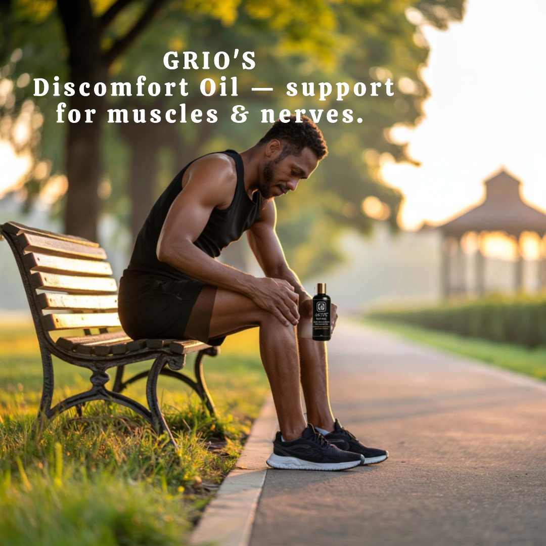A man sits on a park bench after an intense workout, gently massaging Grio’s Discomfort Oil onto his leg to ease muscle and nerve pain. The warm sunlight symbolizes relief, recovery, and the natural balance supported by Always Grio’s handcrafted oils.

