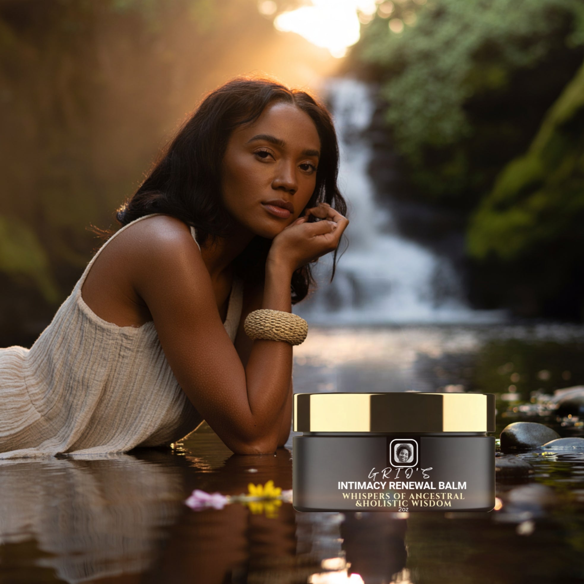 serene woman rests beside a tranquil waterfall at golden hour, with Grio’s Intimacy Renewal Balm in the foreground — capturing harmony, renewal, and the beauty of self-care inspired by nature.




